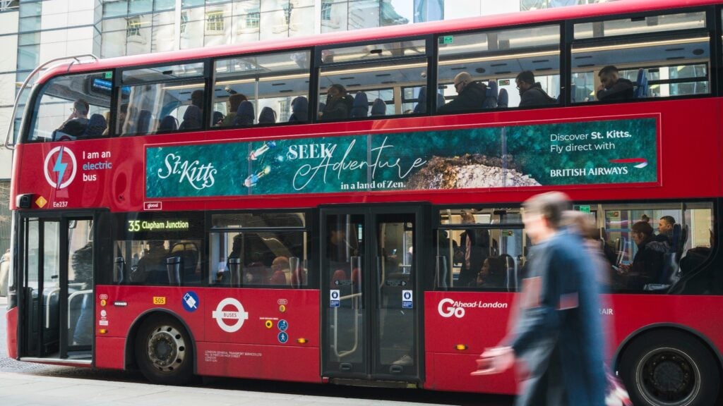 Red Bus in london with signage